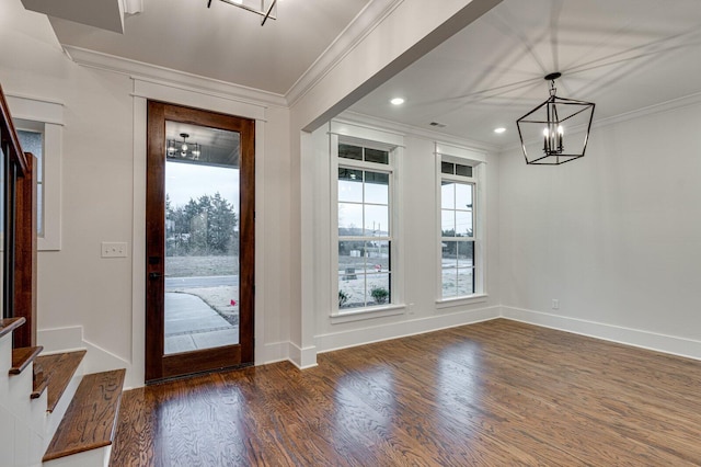 interior space featuring crown molding, dark hardwood / wood-style flooring, and a notable chandelier