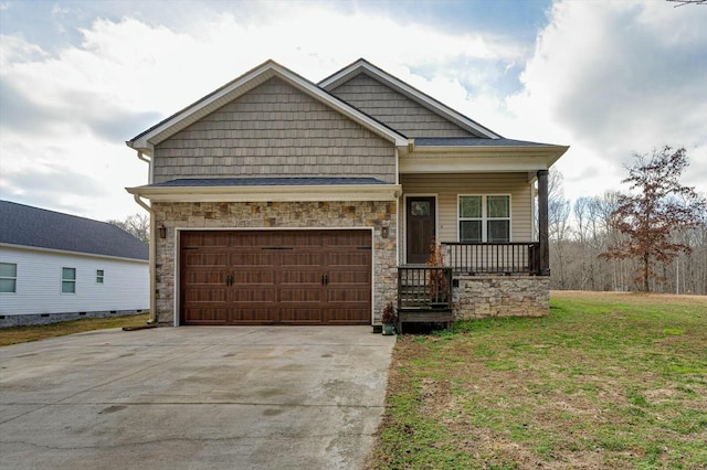 view of front of property featuring a garage, a front yard, and covered porch