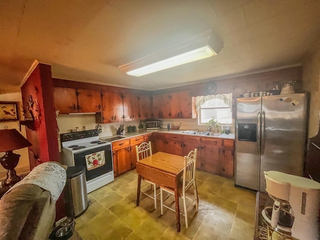 kitchen with white electric range oven, sink, and stainless steel refrigerator with ice dispenser