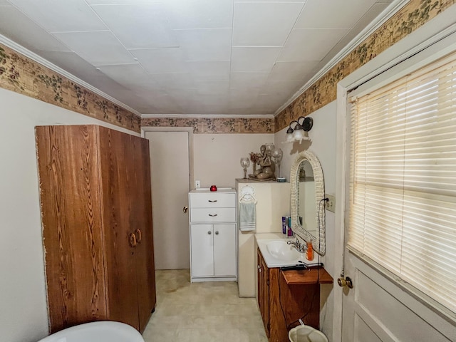 bathroom with vanity and ornamental molding