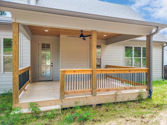 wooden deck featuring ceiling fan