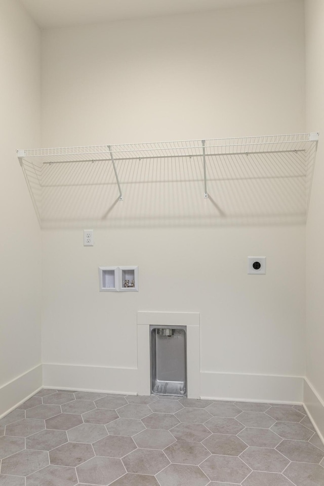 laundry room featuring tile patterned floors, hookup for a washing machine, and hookup for an electric dryer