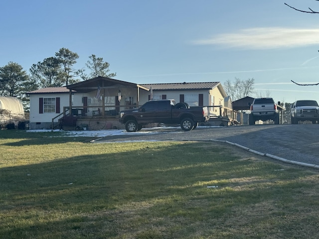 view of front of property with covered porch and a front lawn