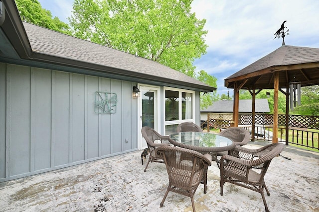 view of patio featuring outdoor dining area and a gazebo