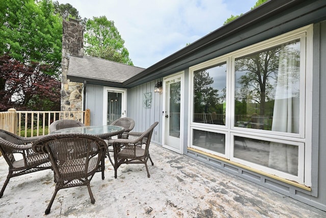 wooden terrace featuring outdoor dining area