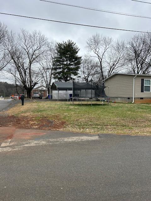 view of front of property featuring a trampoline