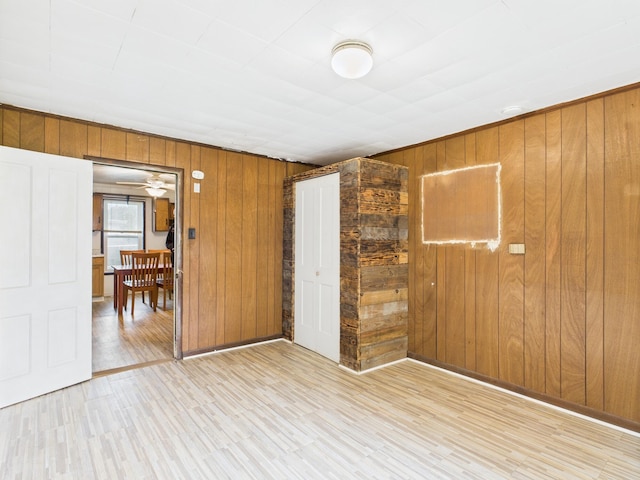 174 E Jackson Ave, Spring City, TN 37381 - unfurnished bedroom featuring wood walls, wood finished floors, and a closet