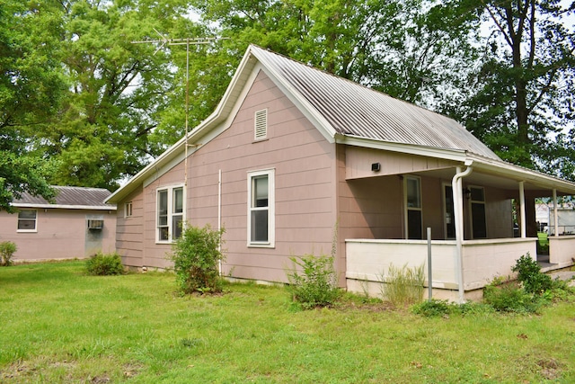 174 E Jackson Ave, Spring City, TN 37381 - view of property exterior featuring a yard and metal roof