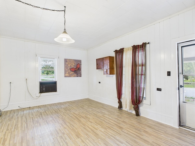 174 E Jackson Ave, Spring City, TN 37381 - unfurnished room with light wood-style flooring, healthy amount of natural light, cooling unit, baseboards, and ornamental molding