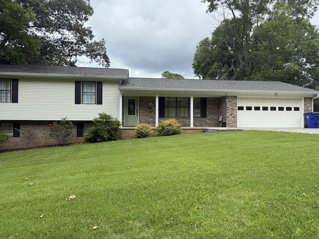 2275 Tenneesee Nursery Rd, Cleveland, TN 37311 - split level home featuring an attached garage, a front yard, brick siding, driveway, and covered porch