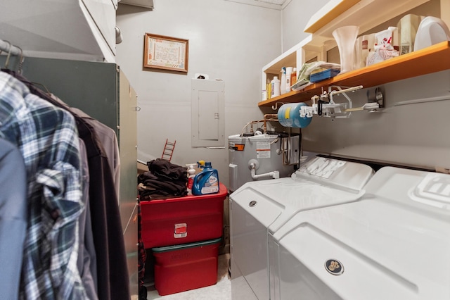 laundry area with water heater, laundry area, electric panel, and washer and dryer