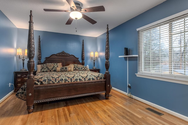 bedroom featuring ceiling fan and hardwood / wood-style floors