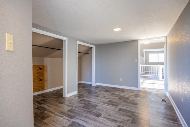 unfurnished bedroom featuring wood-type flooring and a textured ceiling