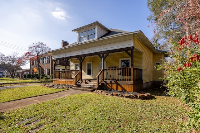 view of front of home featuring a porch and a front yard