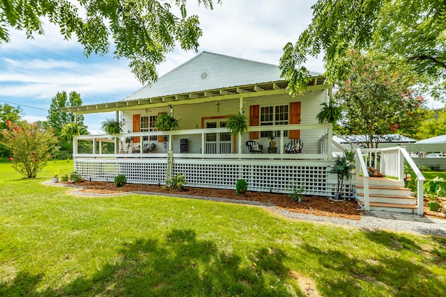 rear view of property with a porch and a yard