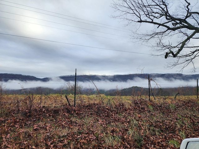 view of mountain feature with a rural view