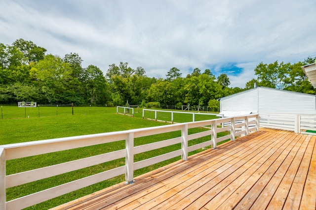 wooden terrace with a lawn