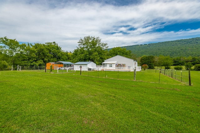 view of yard featuring a mountain view and a rural view