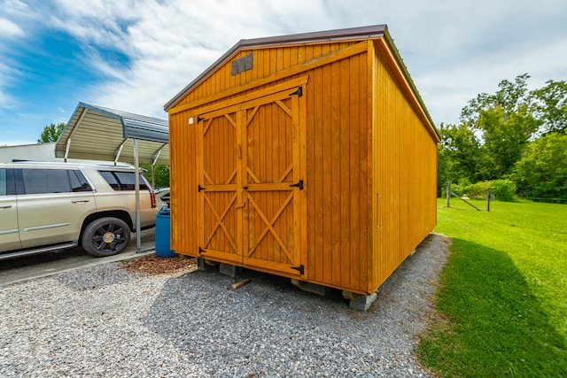 view of outbuilding with a lawn