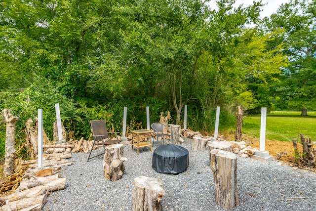 view of patio / terrace with an outdoor fire pit