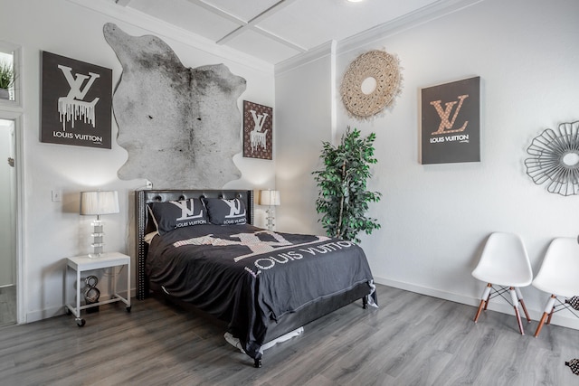 bedroom with wood-type flooring and ornamental molding