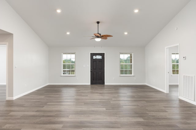 unfurnished living room featuring wood-type flooring, high vaulted ceiling, and ceiling fan