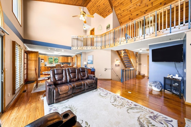 131 Corntassel Shrs, Vonore, TN 37885 - living area featuring baseboards, a ceiling fan, wood ceiling, light wood finished floors, and stairs