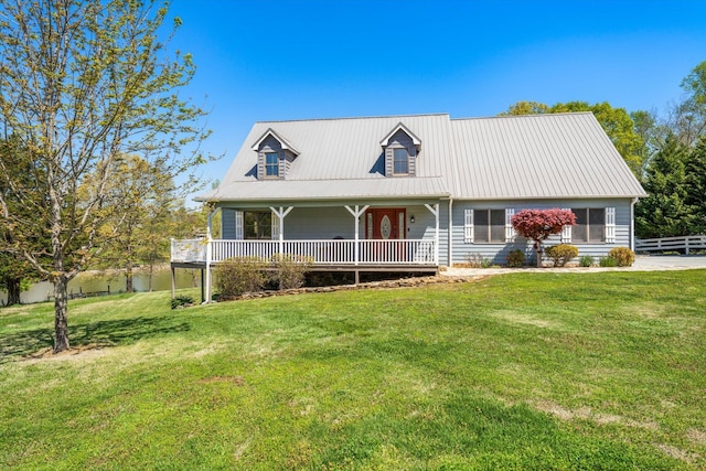 131 Corntassel Shrs, Vonore, TN 37885 - view of front of home featuring a front yard, a porch, fence, and metal roof