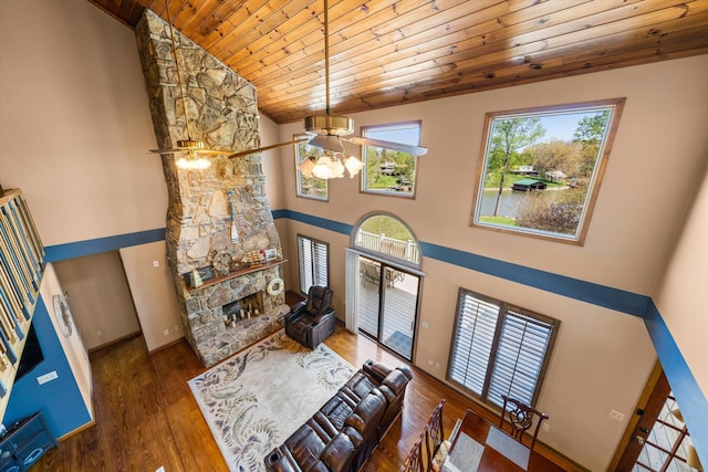 131 Corntassel Shrs, Vonore, TN 37885 - living room with baseboards, a fireplace, wood ceiling, wood finished floors, and high vaulted ceiling