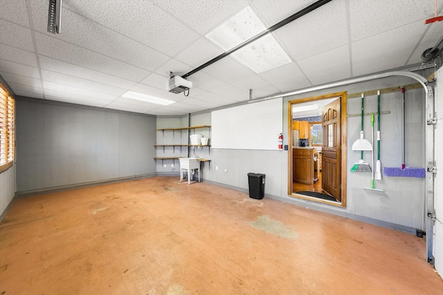 131 Corntassel Shrs, Vonore, TN 37885 - garage with a sink, baseboards, and a garage door opener