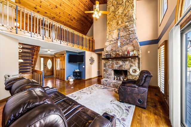 131 Corntassel Shrs, Vonore, TN 37885 - living area featuring wood-type flooring, a stone fireplace, and baseboards