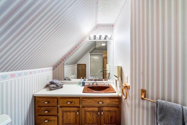 131 Corntassel Shrs, Vonore, TN 37885 - bathroom featuring toilet, wallpapered walls, vanity, and lofted ceiling