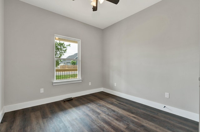 523 13th St SE, Cleveland, TN 37311 - spare room with baseboards, dark wood finished floors, and ceiling fan