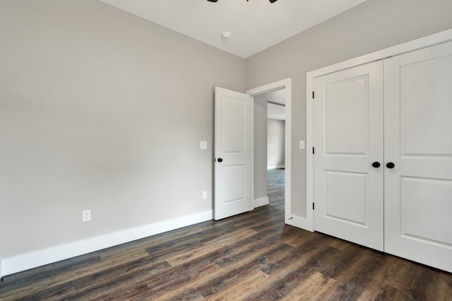 523 13th St SE, Cleveland, TN 37311 - unfurnished bedroom featuring dark wood finished floors, a closet, baseboards, and ceiling fan