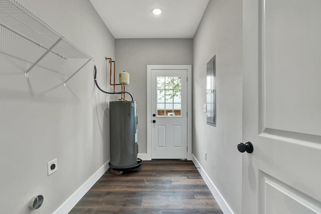 523 13th St SE, Cleveland, TN 37311 - doorway featuring electric water heater, baseboards, and dark wood-style flooring