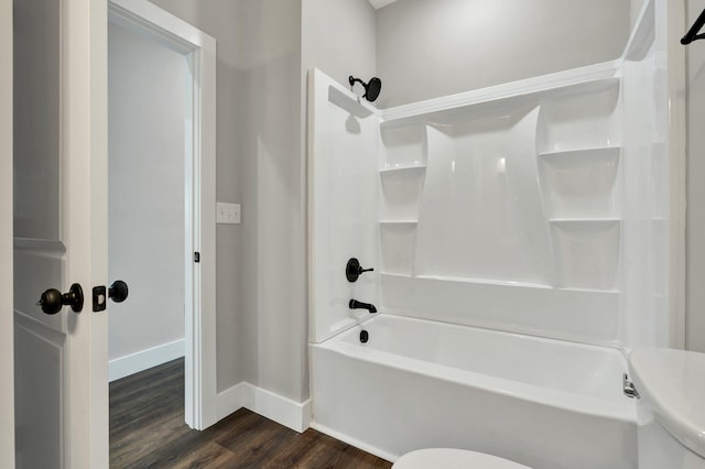 523 13th St SE, Cleveland, TN 37311 - bathroom with baseboards, toilet, wood finished floors, and shower / tub combination