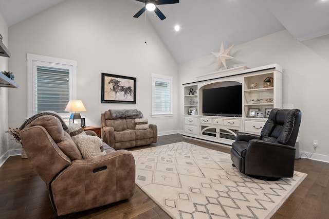 living area featuring baseboards, dark wood-style flooring, high vaulted ceiling, and ceiling fan