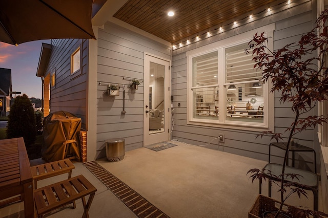 entrance to property featuring a patio