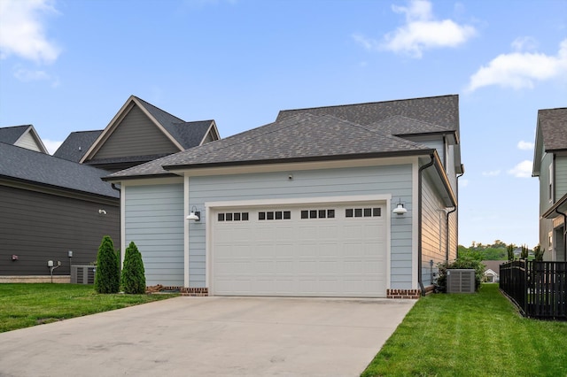 view of front of property featuring a garage, fence, cooling unit, a front lawn, and concrete driveway