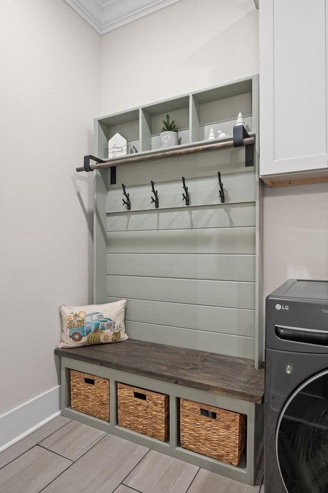 mudroom featuring crown molding, baseboards, and wood finished floors
