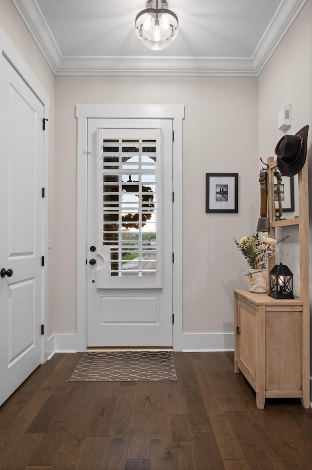 doorway with baseboards, dark wood finished floors, and crown molding