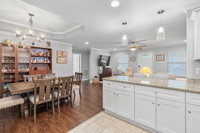 kitchen featuring white cabinets, crown molding, ceiling fan with notable chandelier, and recessed lighting
