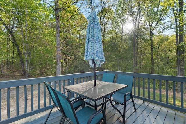 wooden deck featuring outdoor dining space