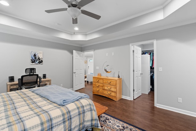 bedroom with recessed lighting, wood finished floors, baseboards, and ornamental molding