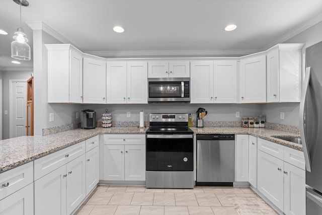 kitchen featuring stainless steel appliances, recessed lighting, white cabinetry, and crown molding