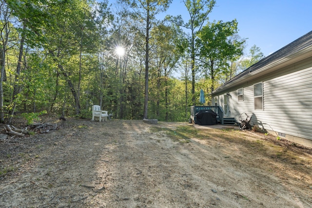 view of yard with a wooden deck