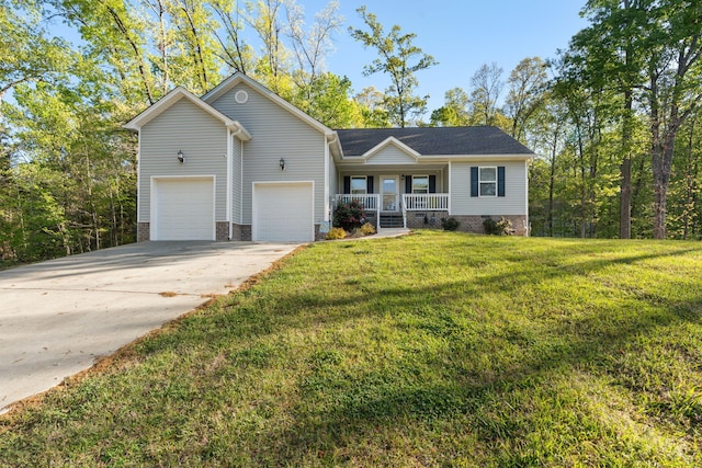 view of front facade with a garage, covered porch, a front yard, and concrete driveway
