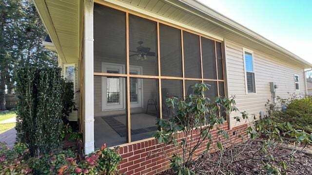 view of property exterior with a sunroom