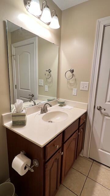 bathroom featuring tile patterned floors and vanity