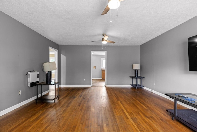 608 Parkview Dr, Chattanooga, TN 37411 - unfurnished living room featuring a ceiling fan, a textured ceiling, hardwood / wood-style floors, and baseboards